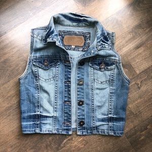 Distressed denim vest